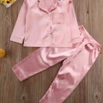 Two-piece pink satin pajamas