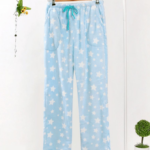 Women's pastel blue fleece pajama bottoms with white background