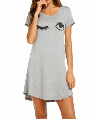 Pyjama nightgown short sleeves grey with eyes pattern worn by a woman