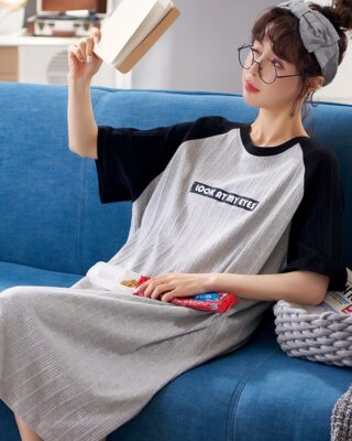 Women's gray cotton nightgown summer pajamas worn by a woman sitting on a sofa in a house