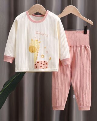 Cotton pyjama set with giraffe motif on a hanger in a house