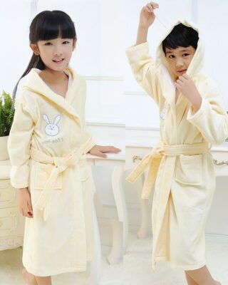 Pyjamas yellow cotton bunny bathrobe for children in fashion, worn by a little boy and a little girl in a fashionable house