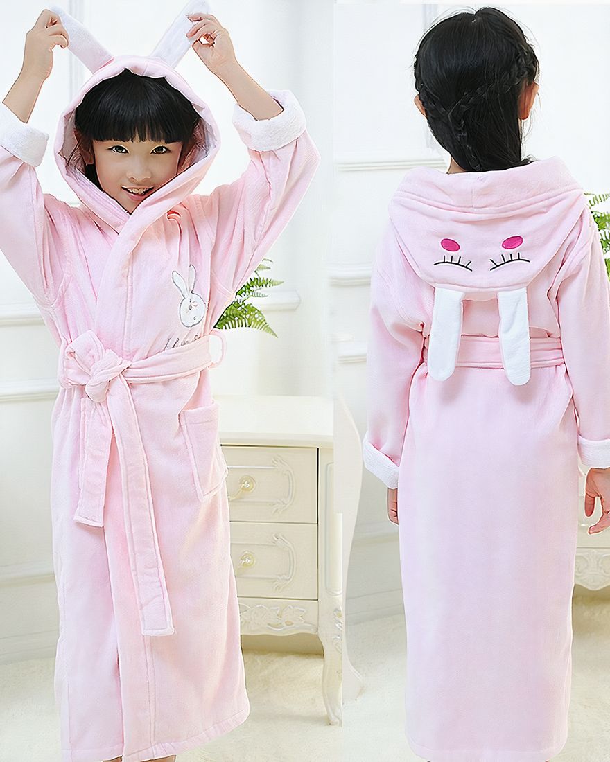 High quality pink cotton bunny pyjamas for girl worn by a little girl in a house