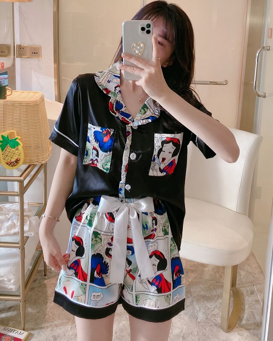 Black silk pajamas with short sleeves Snow White pattern fashionable worn by a woman in a house