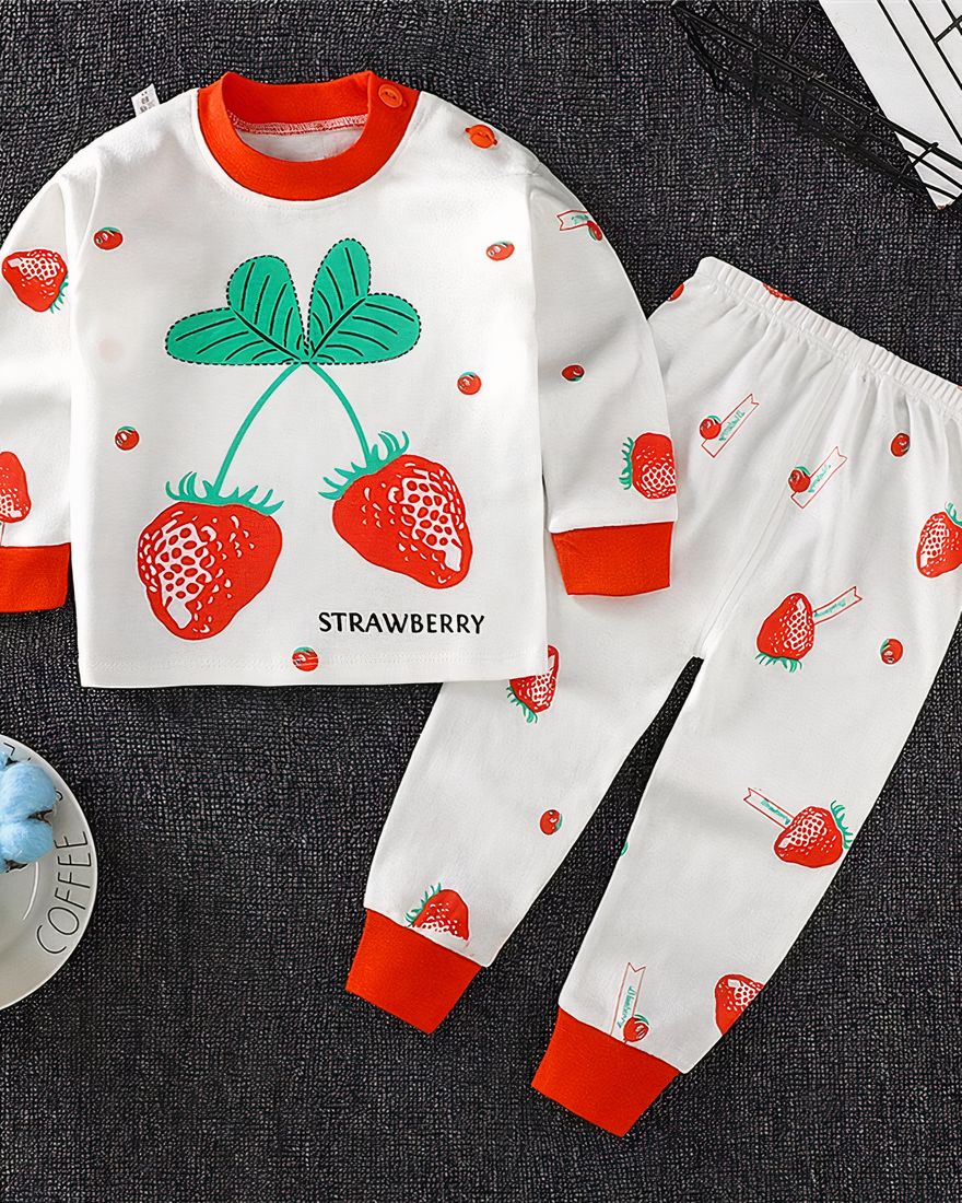 Strawberry cotton pajamas for children on a very high quality carpet