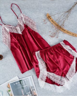 Sexy red satin sleeveless pajama set for fashionable women with magazines on the side