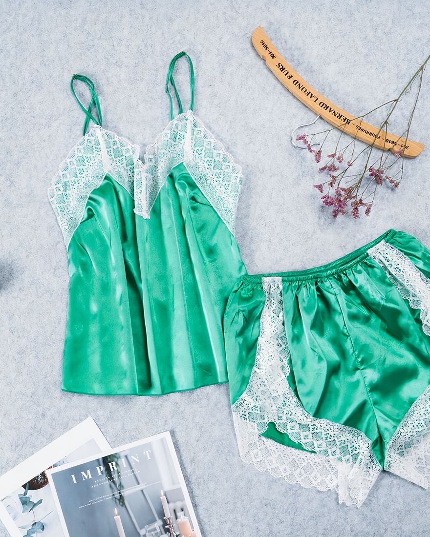 Sexy green satin sleeveless pajama set for women with a magazine on the side