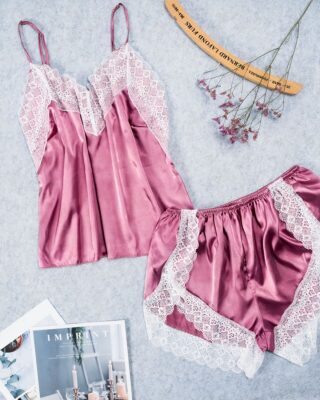 Sexy pink satin sleeveless pajamas for fashionable women with magazines on the side