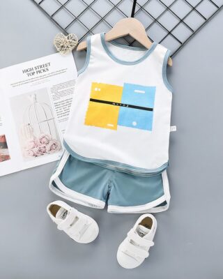 Summer pajamas with white tank top and blue grey cotton shorts with a magazine on a belt