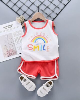 Summer pajamas white tank top and red cotton shorts for a little boy on a belt with a magazine