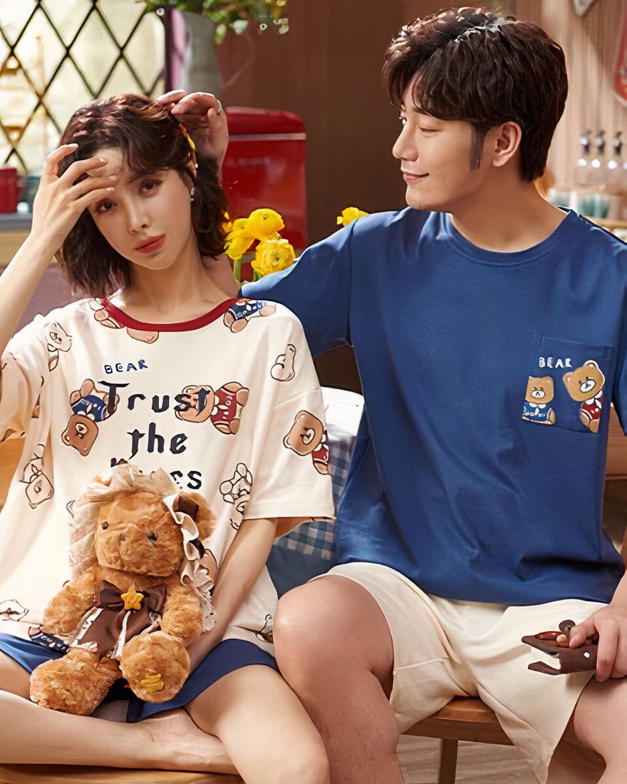 Two-piece cotton pajamas with bear print worn by a fashionable couple in a house