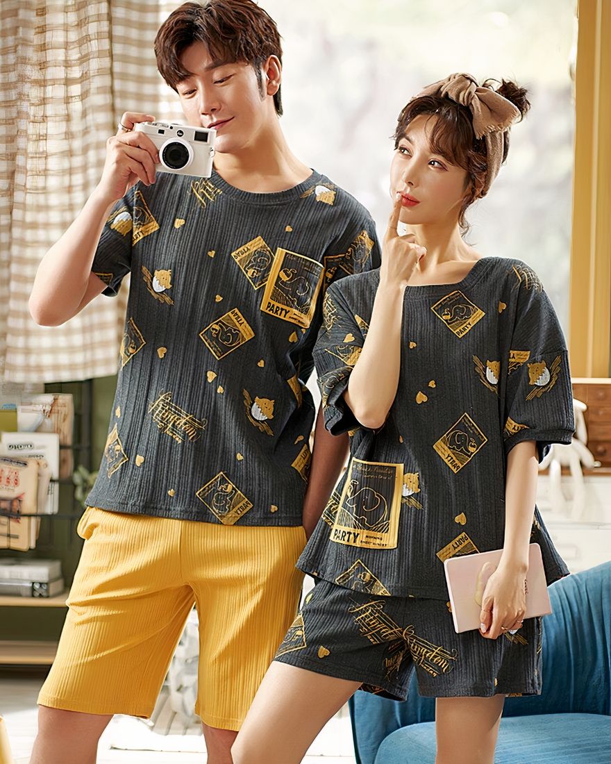 Black patterned t-shirt and cotton shorts pyjamas worn by a couple in a very fashionable house
