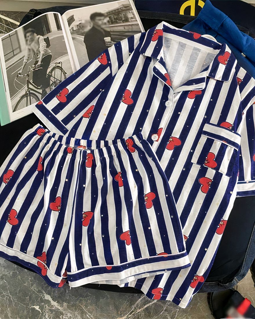 Navy and white striped short-sleeve pajamas with folded collar and magazine on the side