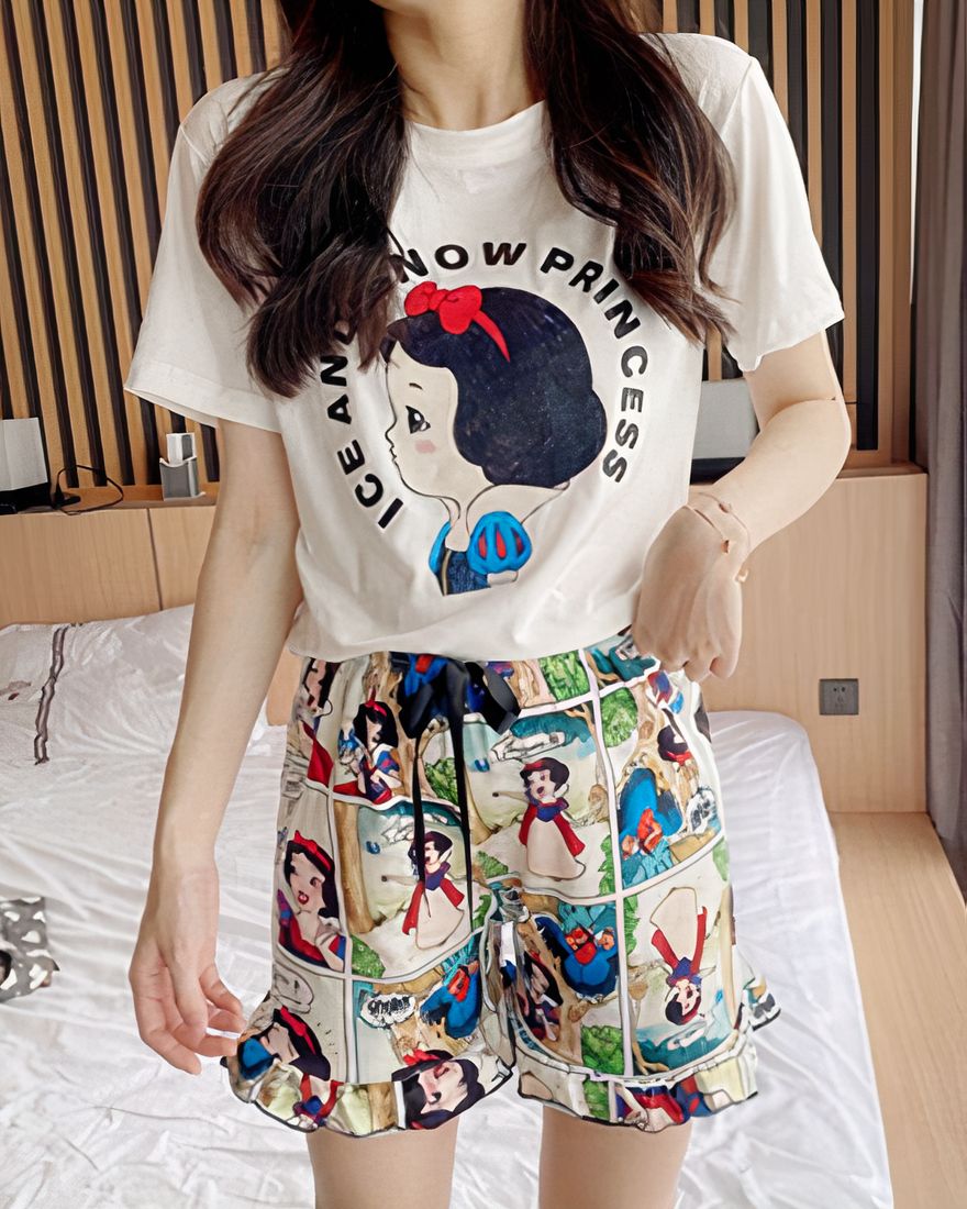 Snow White printed cotton summer pajamas worn by a woman in a house