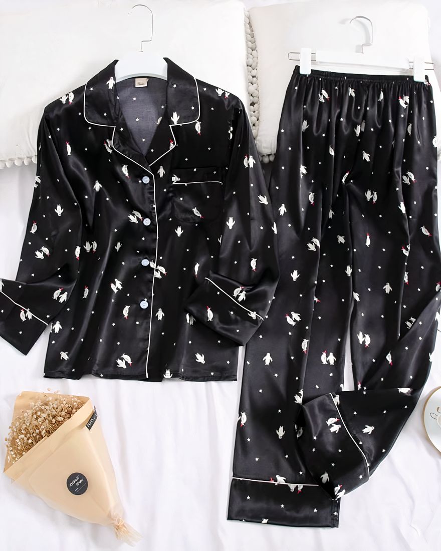 Women's two-piece black long-sleeve fold-over collar pajamas with white pattern on a belt