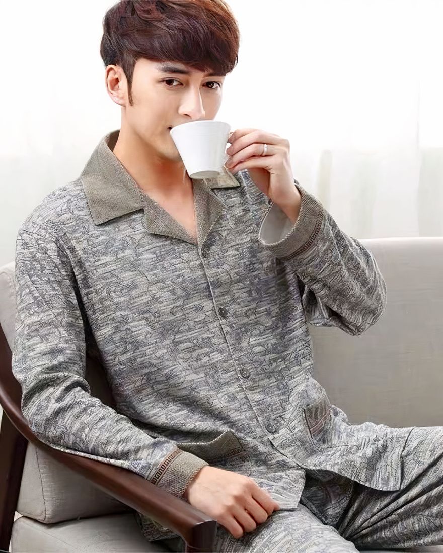 Men's cotton khaki pajamas worn by a man drinking tea in a house