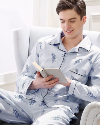 Blue feather pajamas worn by a man sitting on a chair in a house