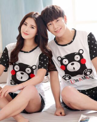 Nightwear for couple with small bear worn by a couple in a house