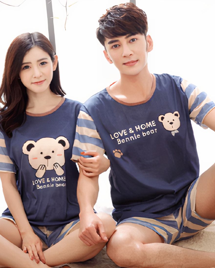 Summer pajamas for couple with bear pattern worn by a couple in a house