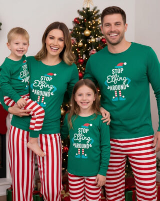 Matching pyjamas for the family worn by a woman, a man, a 7-year-old girl between the two adults, and a boy in the woman's arms.