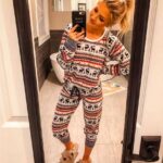 Christmas pajamas with reindeers for women worn by a woman who takes a picture in a mirror very fashionable