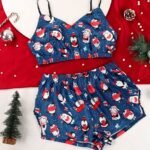 Christmas pyjamas in satin with penguin pattern for women very fashionable on a carpet