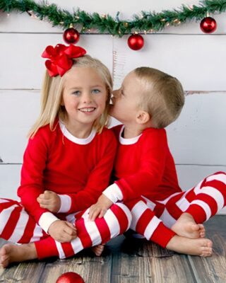 Christmas pajamas with stripes for a little girl and a little boy in fashion