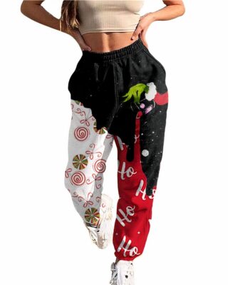 Red and Black women's casual christmas pants worn by a very fashionable woman