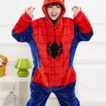 Spider Man pajamas for adults worn by a woman in a house