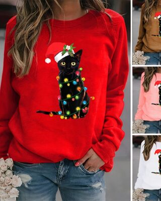 Women's long sleeve Christmas cat sweater worn by a very fashionable woman