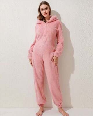 Women's fleece pajama suit in solid pink color worn by a fashionable woman