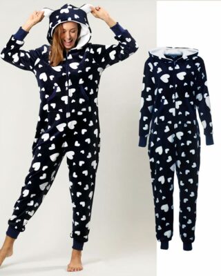 Women's pajama suit with hood and pockets black and white worn by a very comfortable and fashionable woman