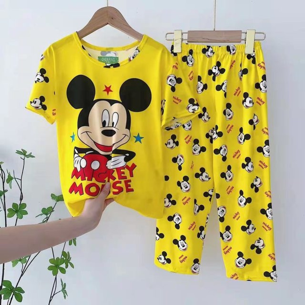 Mickey Mousse yellow summer pajamas for kids on a belt in a house