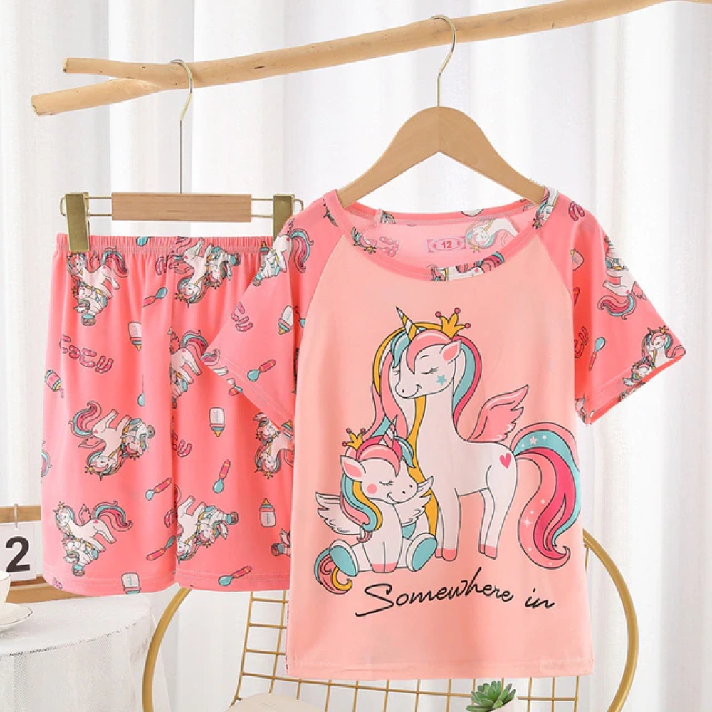 Unicorn summer pajamas for little girl pink on a belt in a house