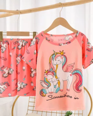 Unicorn summer pajamas for little girl pink on a belt in a house