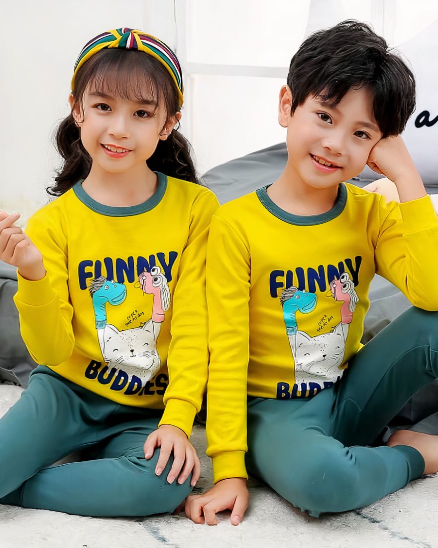 Spring pajamas with yellow sweater and green pants for children with two children, a girl and a boy wearing the pajamas