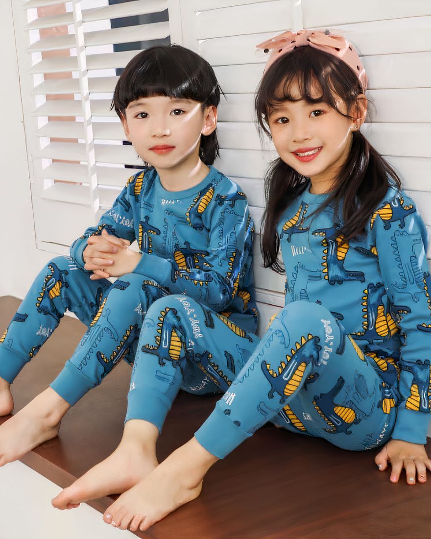 Spring blue dinosaur pajamas for kids with two kids wearing the pajamas