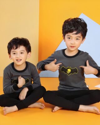 Black spring pajamas with Batman motif for boys with two boys wearing the pajamas