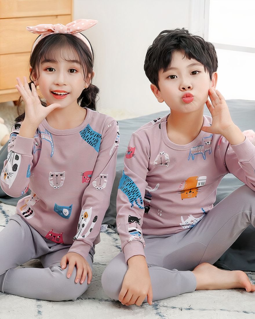 Spring pajamas with pink sweater and gray pants for children with two children wearing the pajamas