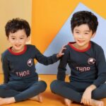 Two-piece spring pajamas with THOR pattern for boy with two children wearing the pajamas