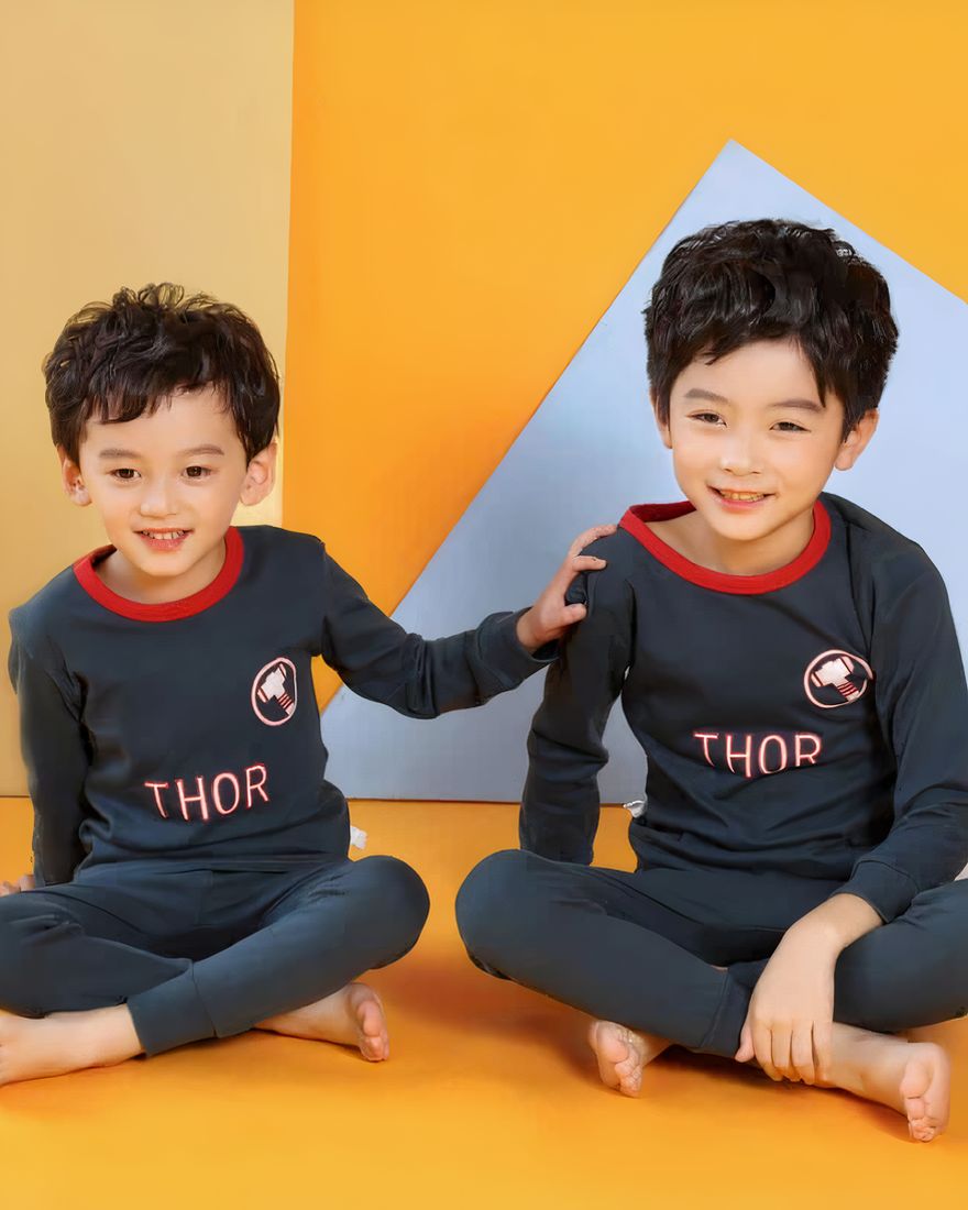 Two-piece spring pajamas with THOR pattern for boy with two children wearing the pajamas