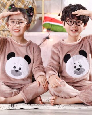 Long sleeve flannel pajamas with panda print for children worn by a little boy and a little girl sitting on a carpet in a house