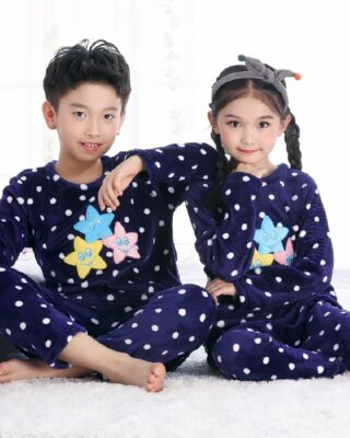 Long sleeve flannel pajamas with mermaid pattern for a little girl and a little boy sitting on a carpet