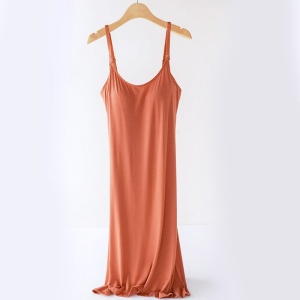 Caramel pregnancy and nursing nightdress on a wooden hanger, on a white background