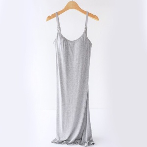 Grey pregnancy and nursing nightgown on a wooden hanger, on a white background
