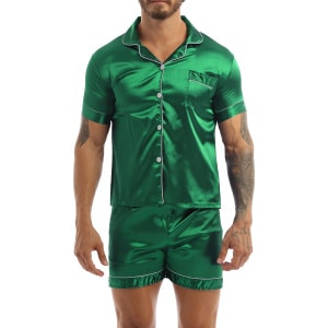 Green satin pajamas worn by a man tattooed on his left arm, the pajamas are composed of shorts and a shirt with buttons on the front