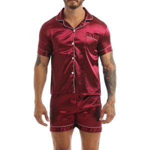 Pyjamas in red satin worn by a man tattooed on his left arm, the pyjamas are composed of shorts and a shirt with buttons on the front
