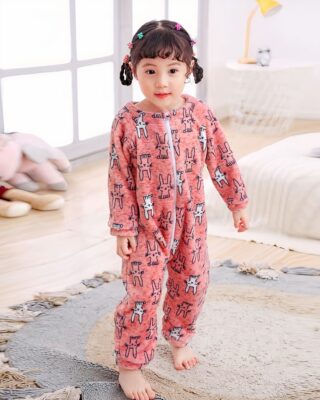 Girl's animal jumpsuits with a little girl wearing the jumpsuit in a nursery background