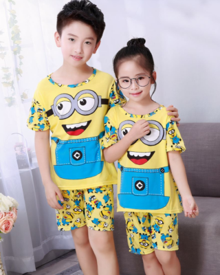 Short sleeve summer pajamas with Minions print for kids worn by kids in a house