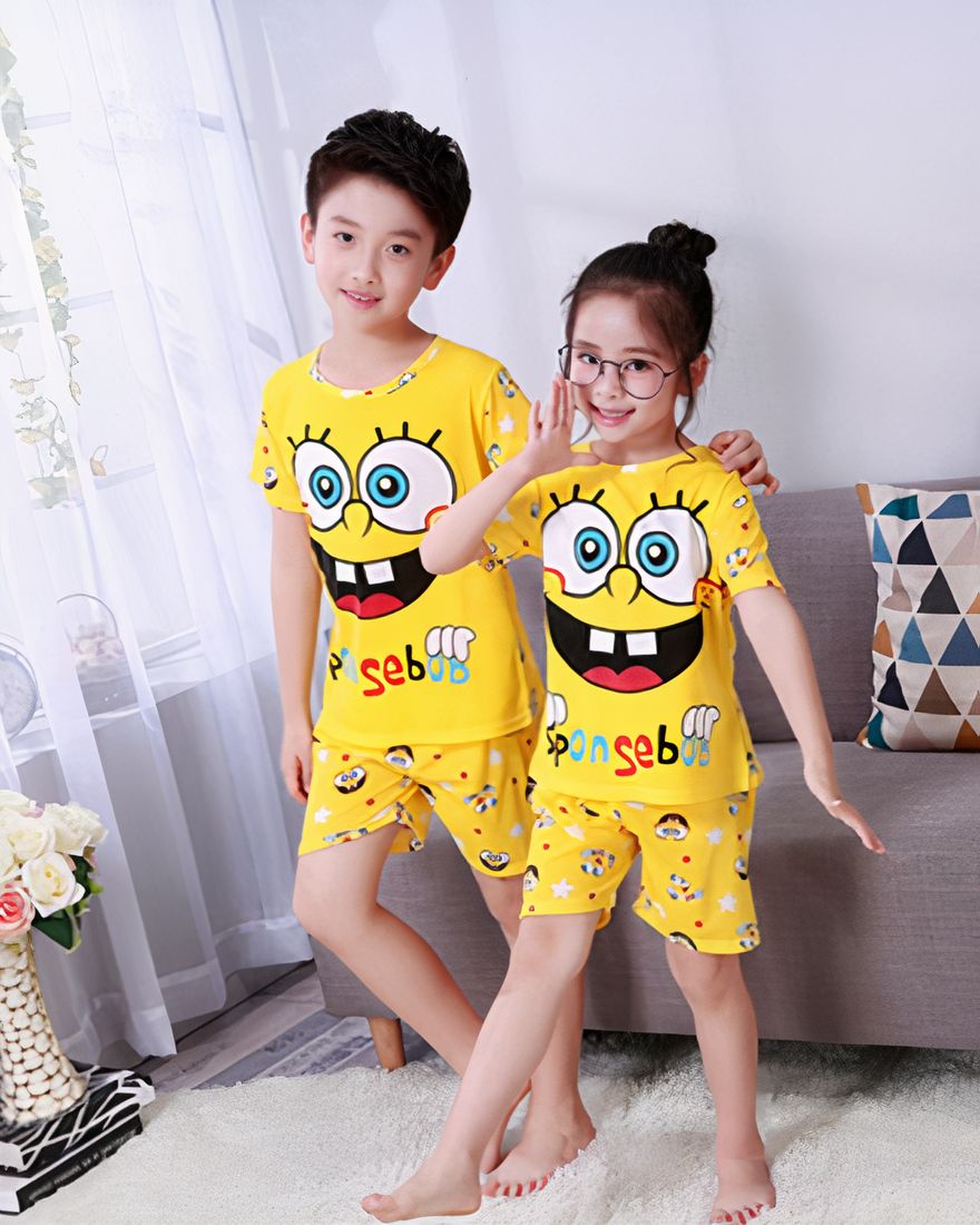 Spongebob patterned yellow summer pajamas for kids worn by kids in a house